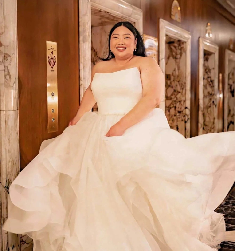 Model wearing a Downtown Gowns Plus Size Collection Gown