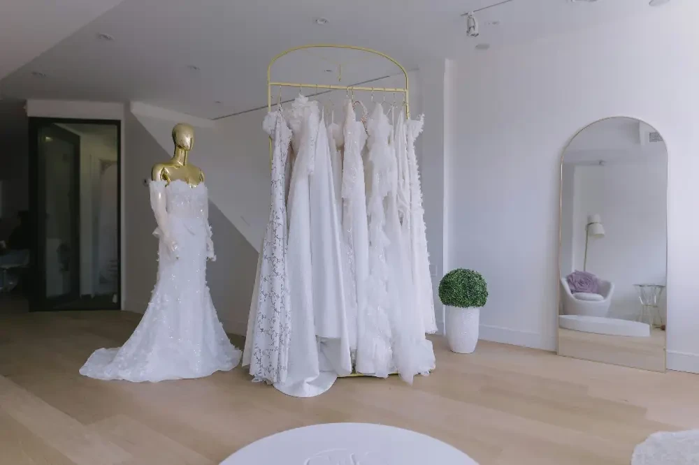 Bride trying on wedding dresses