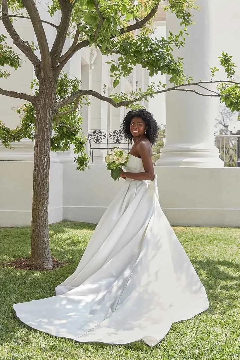 Model wearing a Downtown Gowns Plus Size Collection Gown