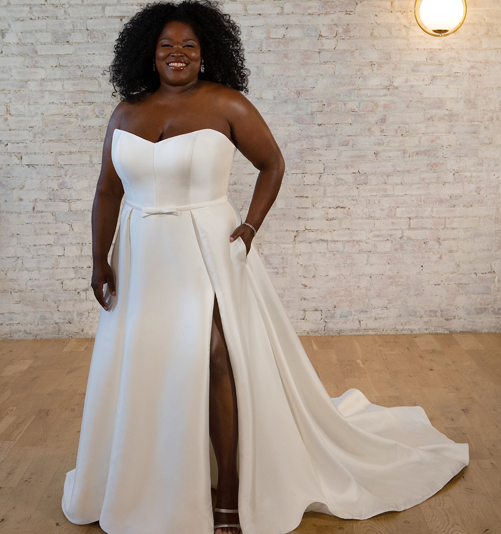 Model wearing a Downtown Gowns Plus Size Collection Gown