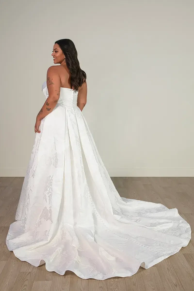 strapless A-line wedding dress with jacquard floral fabric, full skirt and chapel train, back view of bride wearing SY8084